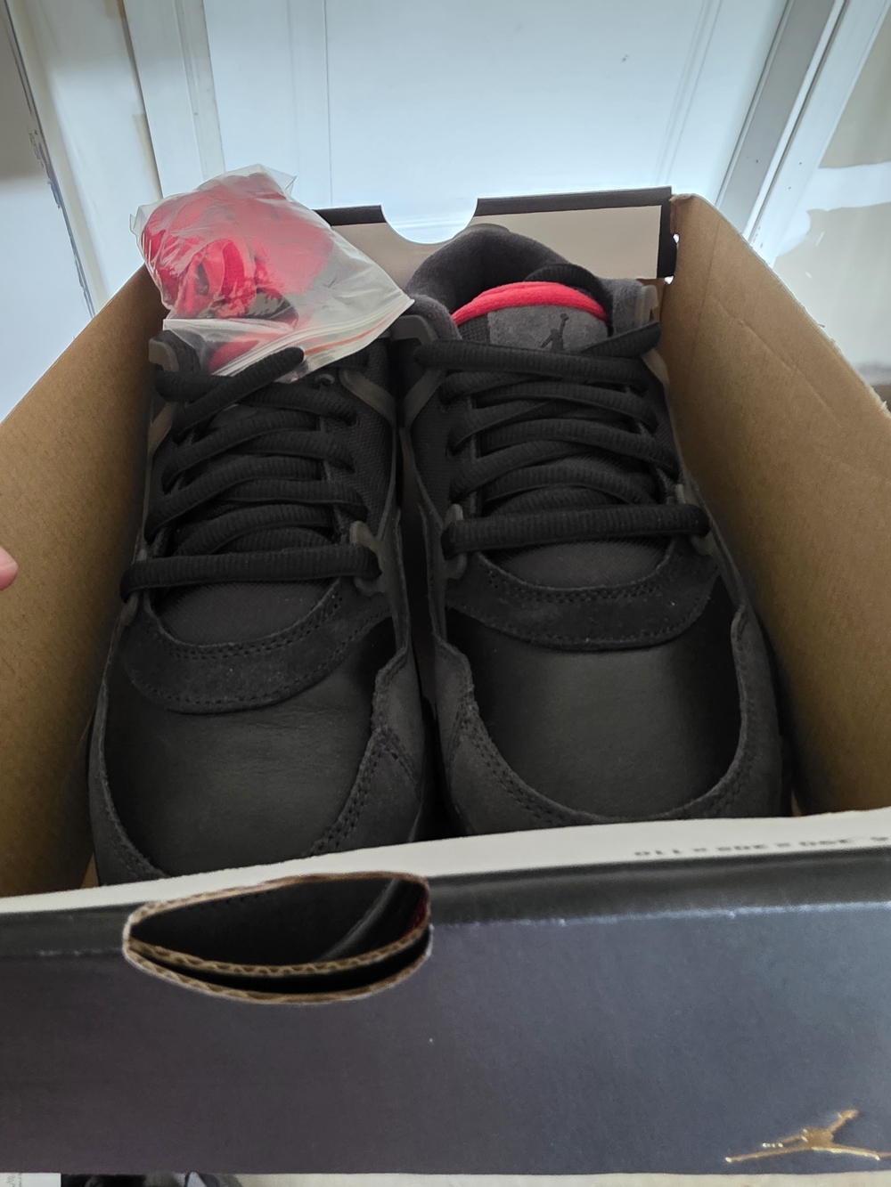 Jordan Men's Black Sneakers with Red Tongue Accent